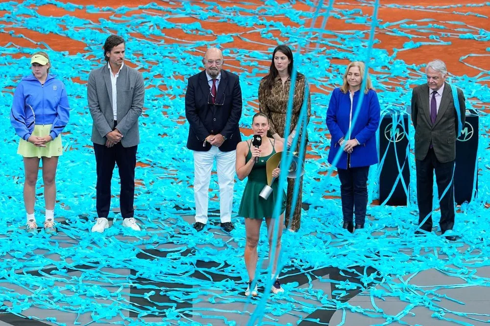 Marta Kostyuk of Ukraine celebrates the victory with the trophy after winning against Mirra Andreeva of Russia during the Women's Singles Final of Mutua Madrid Open 2026 at La Caja Magica on May 02, 2026 in Madrid, Spain. AFP7 02/05/2026 ONLY FOR USE IN SPAIN